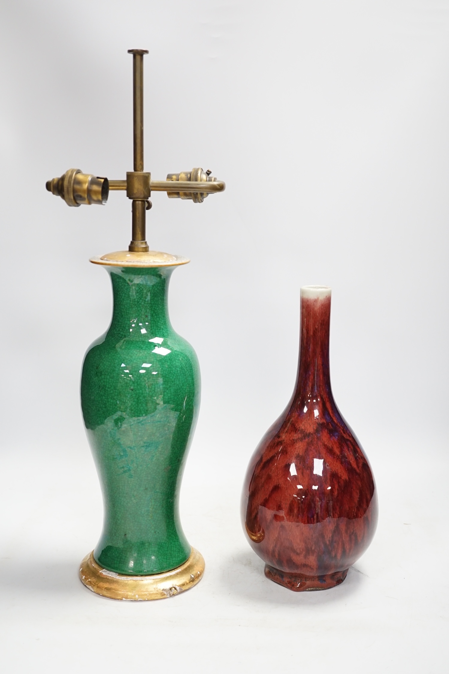 A Chinese green crackle glazed vase converted to a lamp base and a flambé style vase, lamp base 50cm high including light fitting. Condition - fair, losses to the gilt base of lamp base